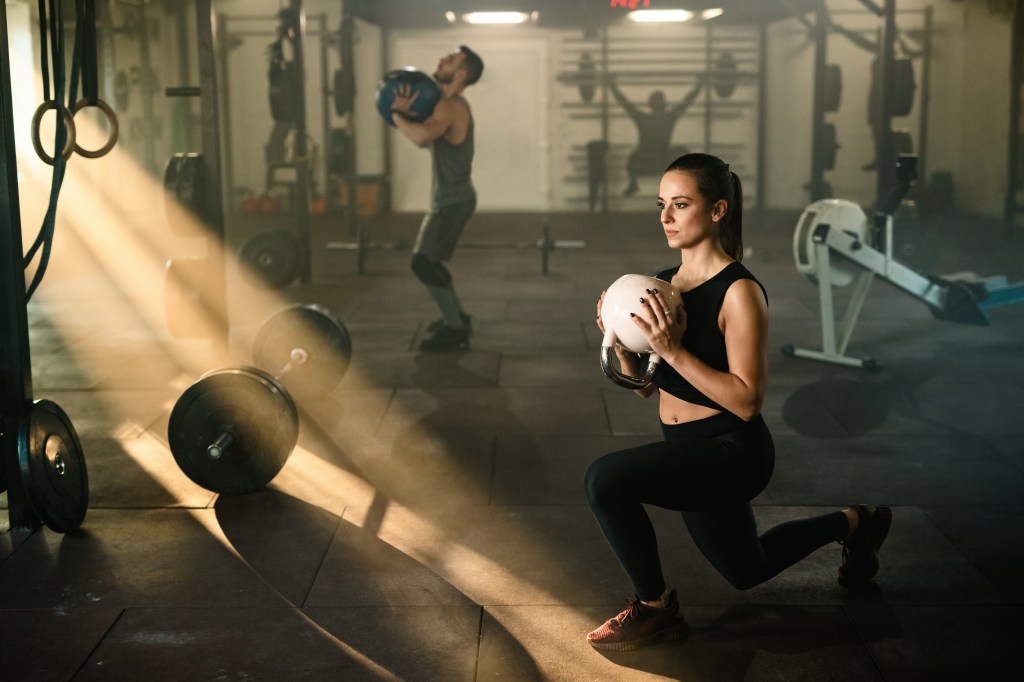 Woman performing a weighted lunge