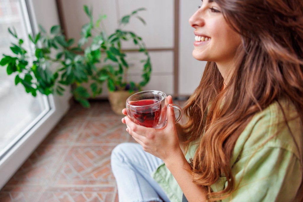 Young women sipping herbal tea