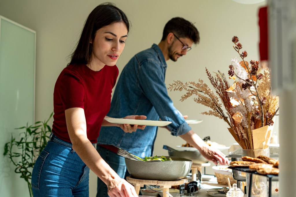 A woman serving herself at an event
