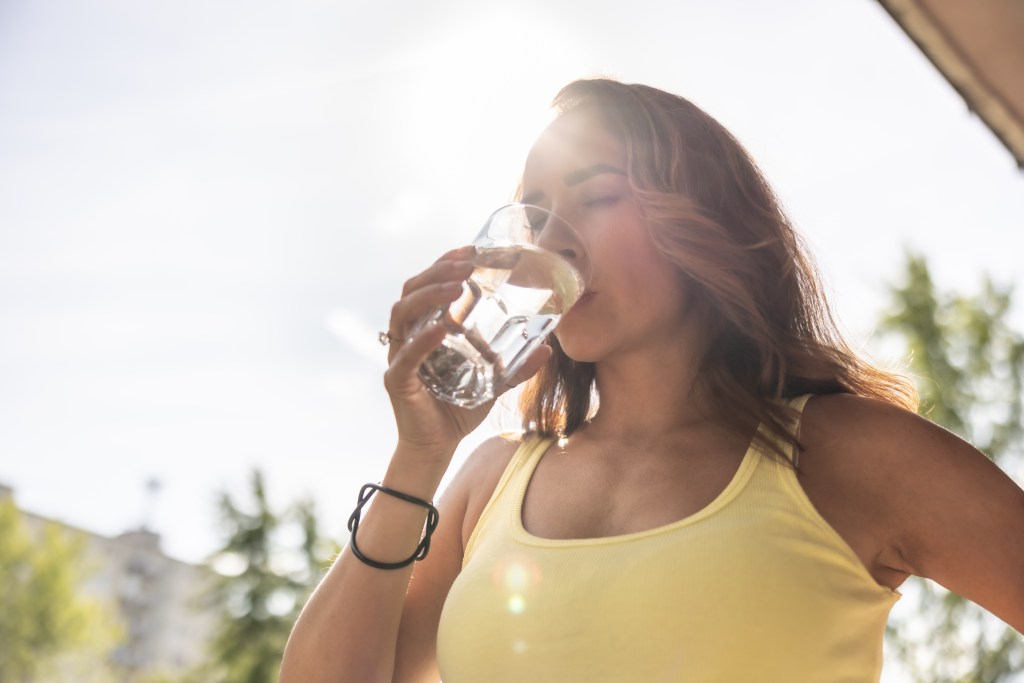 Women drinking water outside