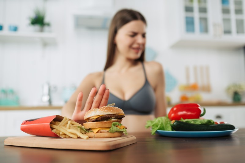 Woman rejecting junk food