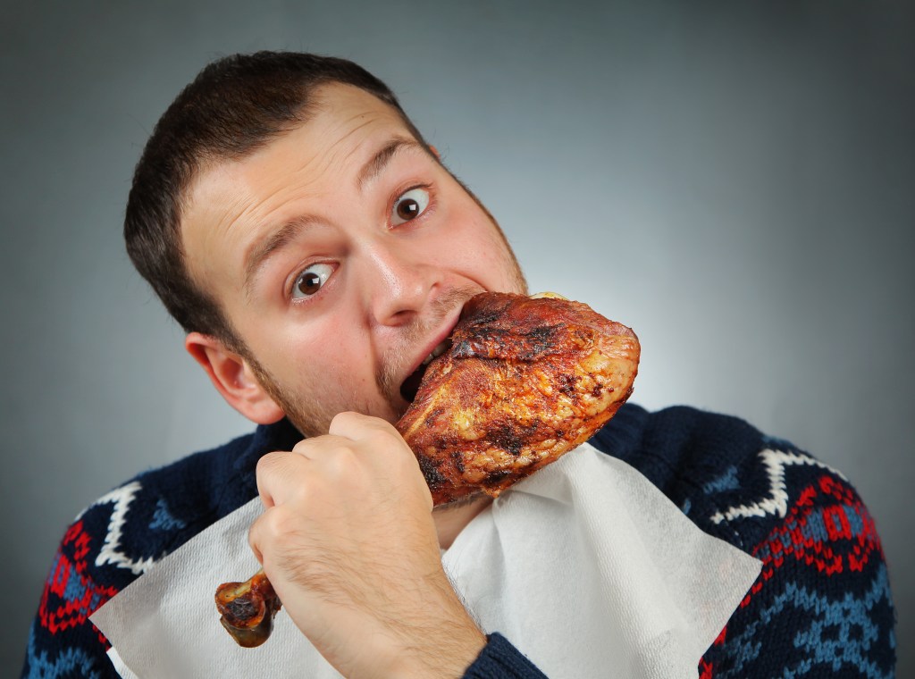 Man eating meat