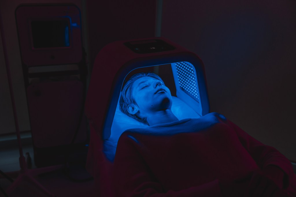 Woman under a blue light lamp&nbsp;&nbsp;