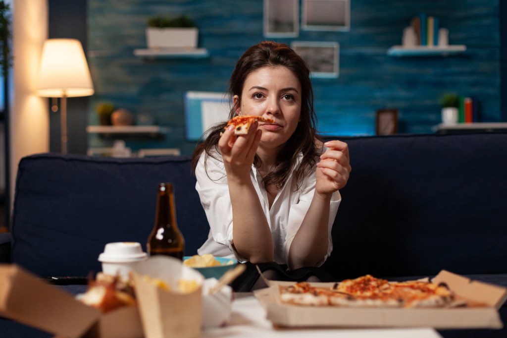 Woman eating junk food