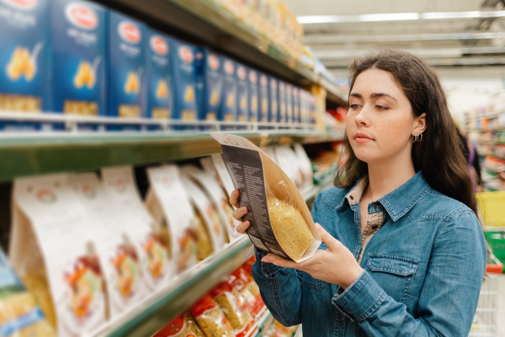 Woman reading food label