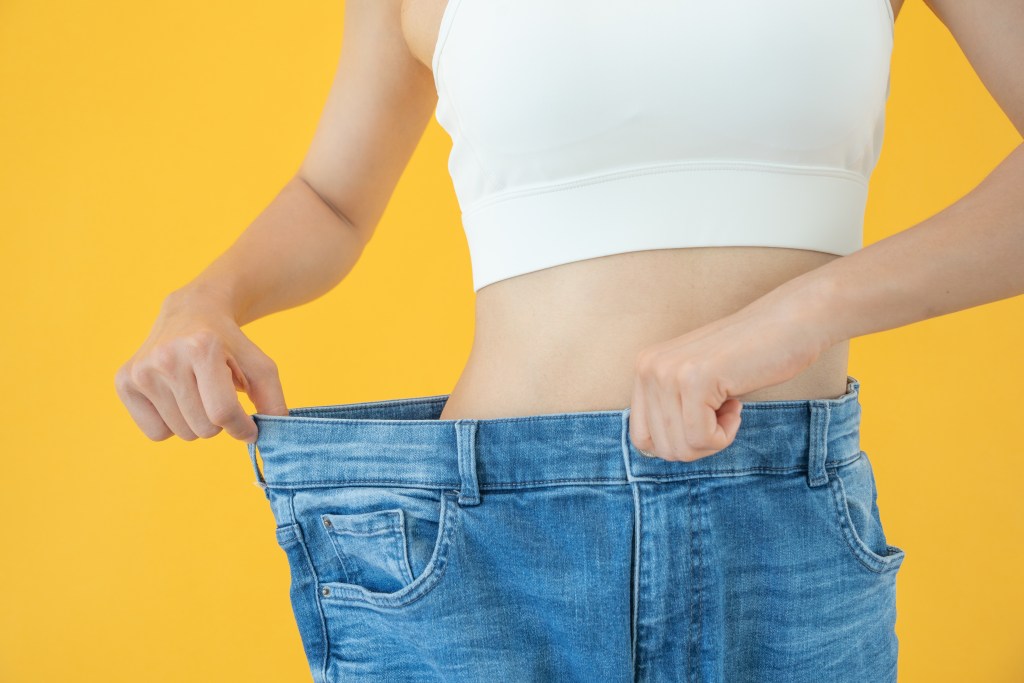 Woman in oversized jeans