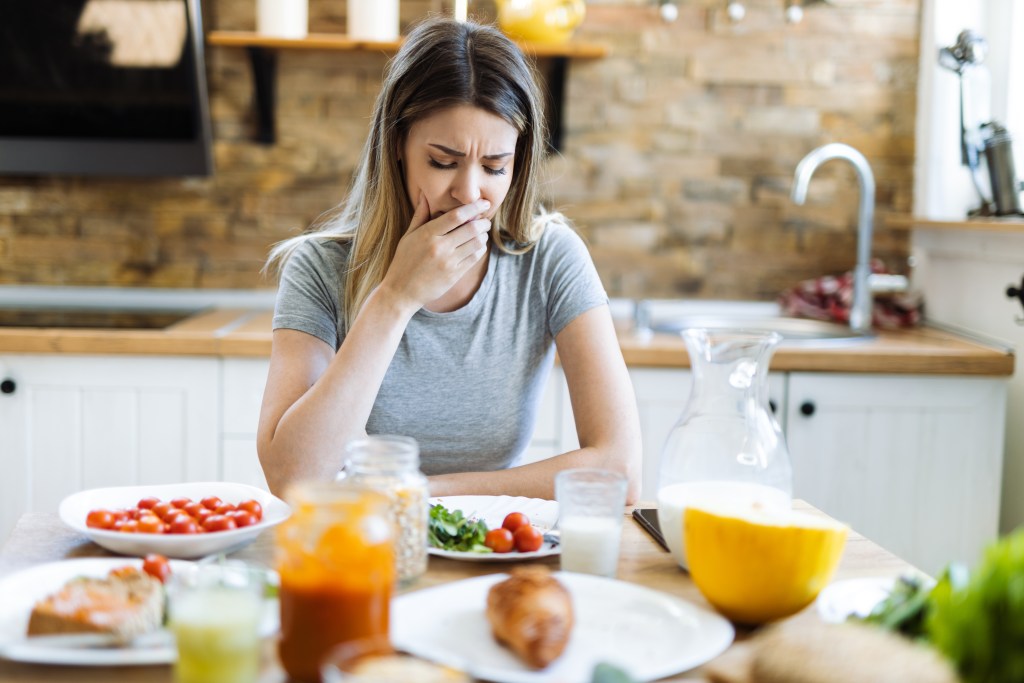 Women feeling sick after eating